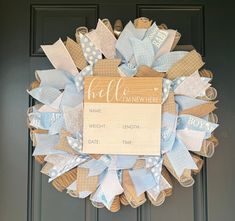 a blue and white wreath with a sign on it