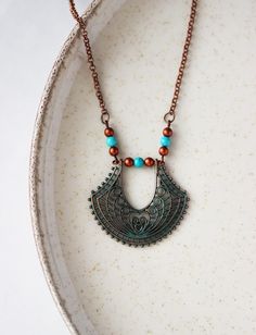 This beautiful unique ethnic boho style necklace was made of copper charm with blue patina, natural turquoise stone round 4 mm beads, tiny czech glass "red copper" colore beads and copper chain with copper lobster claw. The chain is from lead free & nickel free metal. NOTE: This necklace is worn over the head. The circumference (pendant with chain) is 69 cm or 27.1 inches. Other necklaces of my shop you can see here: https://www.etsy.com/shop/NaTavelli?section_id=14843046&ref=shopsection_leftnav_5 Thanks for a visit. Boho Pendant Necklace, Anchor Jewelry, Boho Style Necklaces, Natural Turquoise Stone, Stainless Steel Chain Necklace, Starfish Necklace, Red Copper, Hippie Necklace, Boho Pendant