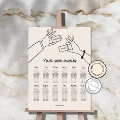 a wedding seating chart on a easel with two hands reaching for each other's hand