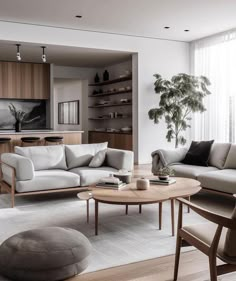 a living room filled with furniture and a large window