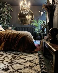 a bedroom with a bed, mirror and plants