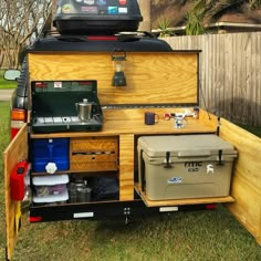 the back end of a truck with an ice chest and cooler