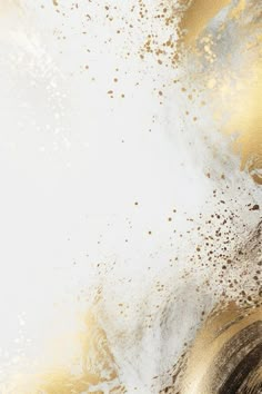 an abstract gold and white background with lots of dust on the bottom right hand corner