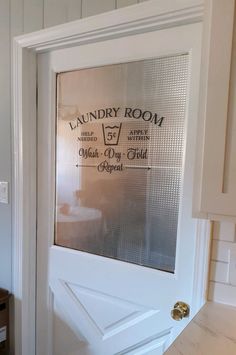 the laundry room door is open to reveal what's inside