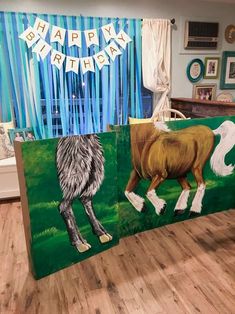 a birthday banner with horses painted on it