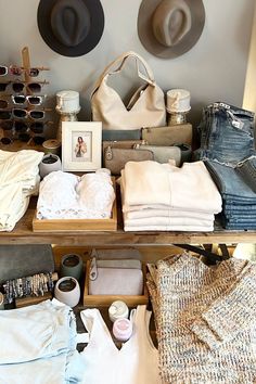 hats, clothing and other items are displayed on a table