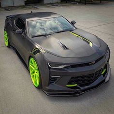 the chevrolet camaro is painted in neon yellow