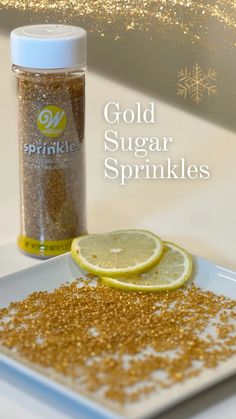 gold sugar sprinkles on a white plate next to a bottle of sparkling glitter