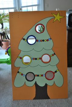 a cardboard christmas tree with circles on it