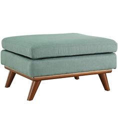 the footstool is made from wood and has a light blue upholstered fabric