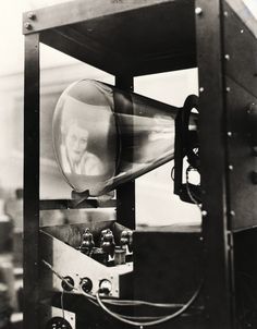 a black and white photo of a machine with a light on it's side