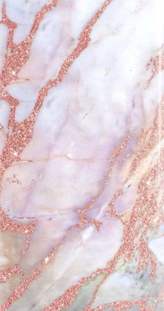 an abstract marble background with pink and gold flecks