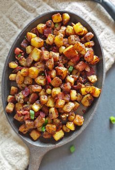 a bowl filled with cooked potatoes on top of a table