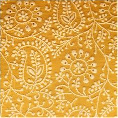 an intricately designed yellow background with white flowers and leaves on the side, as well as