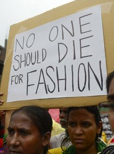 two women holding a sign that says no one should die for fashion