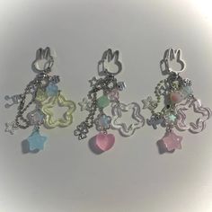 three charms that are sitting next to each other