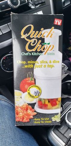 a box of quick chop on the dashboard of a car