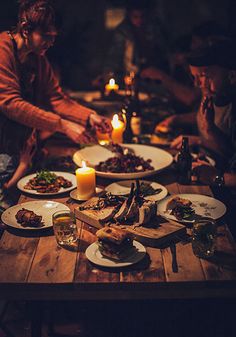 a table with plates and candles on it that says, boldly offering what you've got