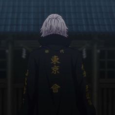 an anime character with white hair wearing a black jacket and standing in front of a building