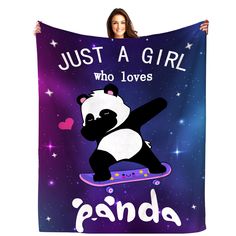 a woman holding up a panda bear on a skateboard that says, just a girl who loves panda