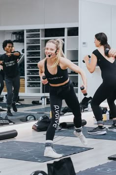 a group of people doing exercises in a gym