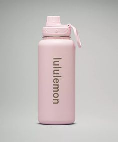 a pink insulated water bottle with the word'uni - neon'printed on it