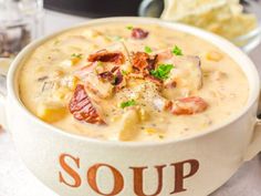 a bowl filled with soup sitting on top of a table