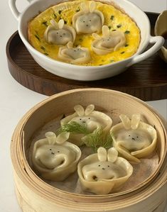 some dumplings are sitting in a bowl on a table