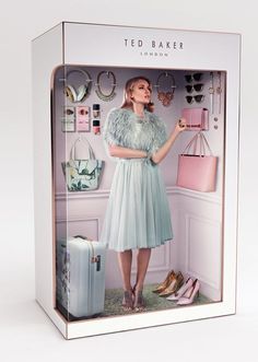 a cardboard box with a woman in a dress and purse