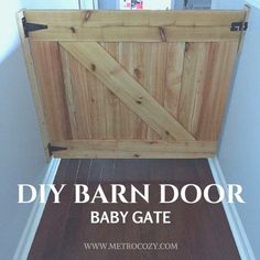 a baby gate with the words diy barn door on it