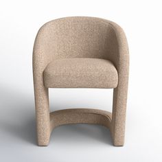 a beige chair sitting on top of a white floor