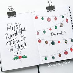 an open notebook with christmas ornaments on it and the words, it's the most wonderful time of the year