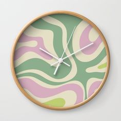 a wall clock with an abstract design on it