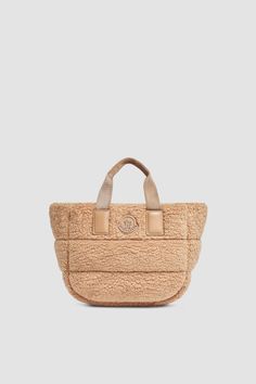 Inspired by iconic Moncler down jacket, the Caradoc bag is crafted from quilted teddy fleece. Boasting an architectural, trapezoid shape, the mini tote fits your daily work or shopping essentials. Shopping Essentials, Mini Tote Bag, Mini Tote, Small Accessories, Small Bags, Tote Bag