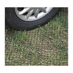 the tire of a car parked on grass