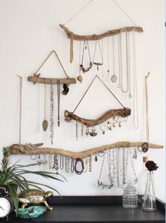 an image of a wall hanging with jewelry on it