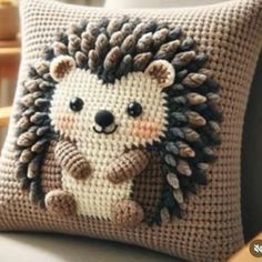 a crocheted hedge pillow sitting on top of a couch