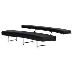 two black benches sitting next to each other