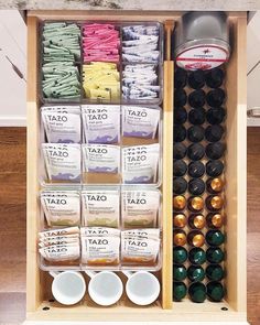 an organized spice rack with spices and condiments in it on a wood floor