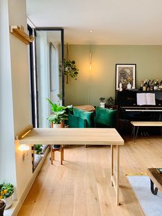 a living room filled with furniture and a piano