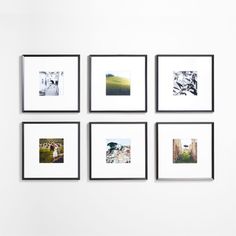 six black and white photographs hanging on a wall