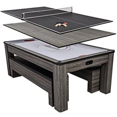 the ping pong table is set up with two tables on top and one in the middle