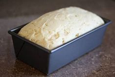 a loaf of bread sitting in a black container