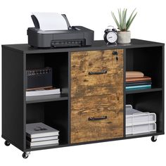 an office cabinet with drawers and printer on top, next to a desk with files