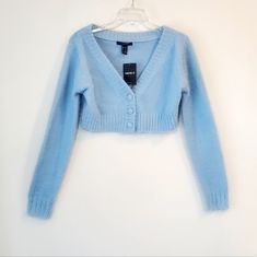 New With Tags Light Blue Color Soft And Fuzzy V-Neck And Button Down Cropped Style Long Sleeves Stretchy Pit To Pit 18.5" Waist 16" Length 14" Sleeve Length 24.5" Trendy Cropped Blue Sweater, Casual Blue Soft Knit Cropped Sweater, Blue Long Sleeve Cropped Sweater In Soft Knit, Blue Cropped Cardigan, Blue Knit Long Sleeve Cropped Sweater, Blue Long Sleeve Cropped Soft Knit Sweater, Elsa Outfit, Blue Sweater Outfit, Sparkle Cardigan