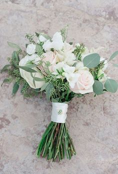 a bouquet of white flowers on the ground