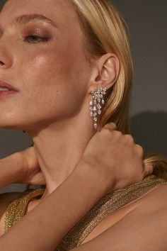 Add a touch of modern glamour to your outfit with these statement-making chandelier earrings featuring carefully placed mixed-cut CZ stones. Elevate your look with a sparkling touch of intricate detail. Silver And Diamond Earrings, Statement Diamond Earrings, Statement Earrings Diamond, Wedding Earring, Crystal Statement Earrings, Cluster Chandelier, Gold Chandelier Earrings, Silver Statement Earrings, Bride Earrings