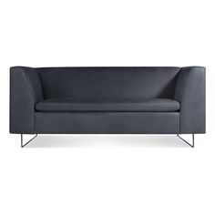 a gray couch with black legs and arms