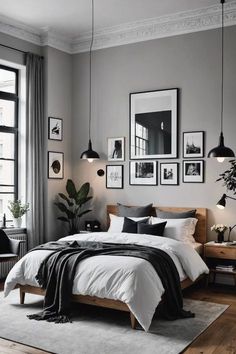 a bedroom with gray walls and pictures on the wall above the bed, along with an area rug