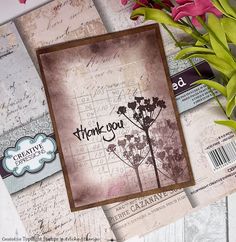 a card with some flowers on top of it